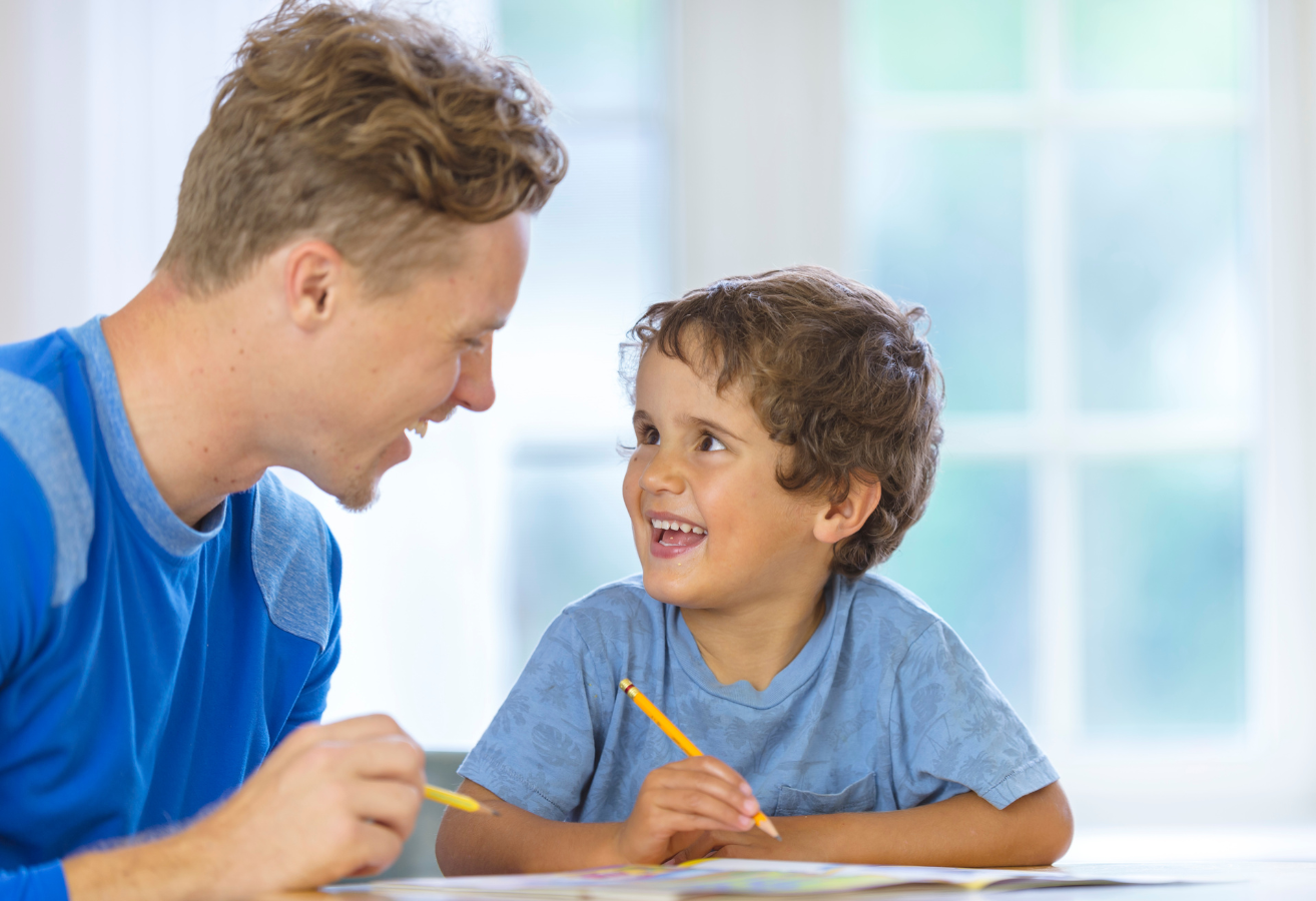 College Aged Boy tutoring k-12 grade student